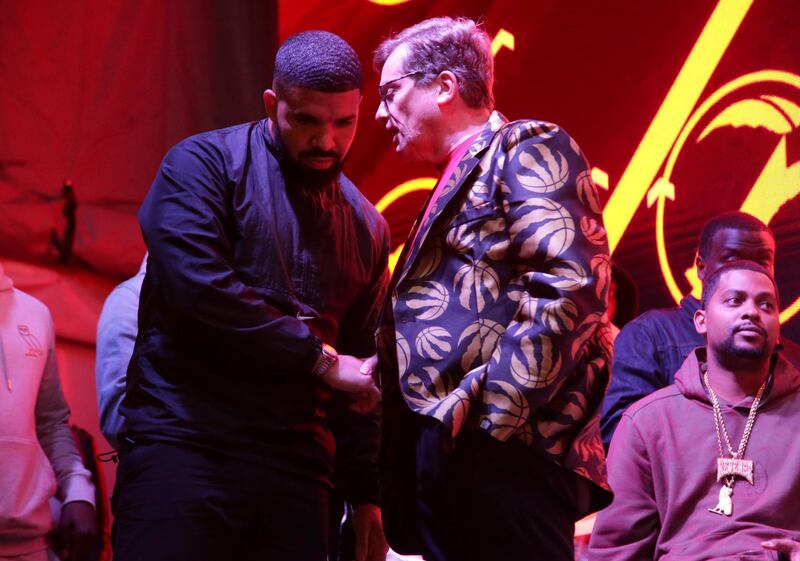 Recording artist Drake and Toronto mayor John Tory greet each other. Reuters
