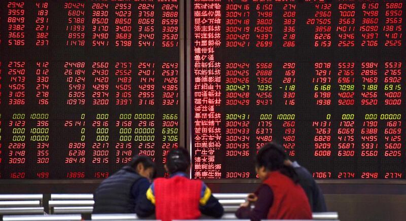 Global stocks hurt by China’s trade threats, falling bond yields. Fred Dufour / AFP