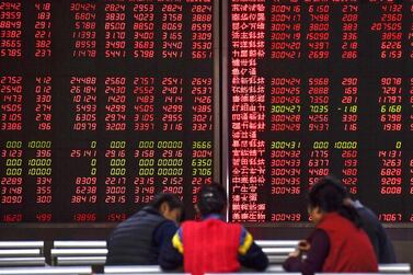Global stocks hurt by China’s trade threats, falling bond yields. Fred Dufour / AFP