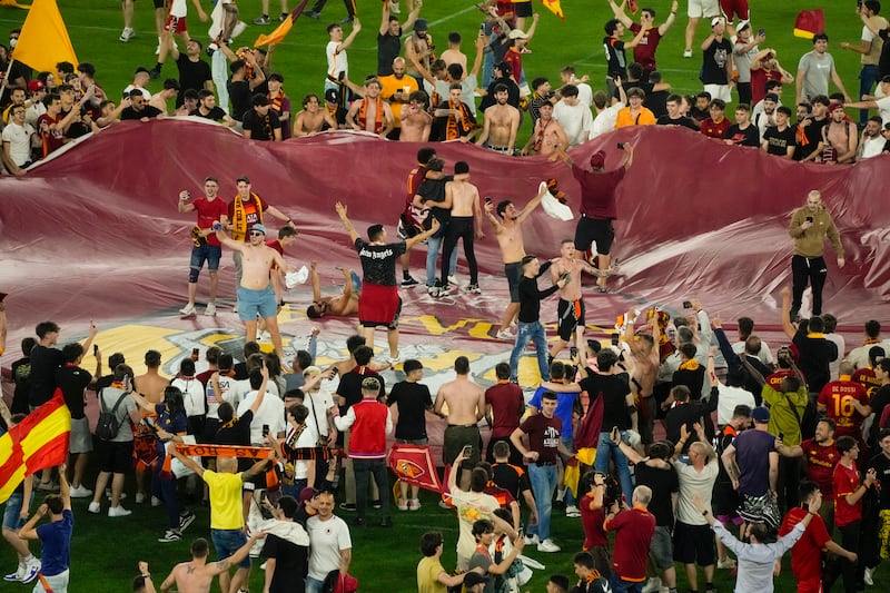 Supporters of AS Roma celebrate inside the Olympic Stadium in Rome. AP