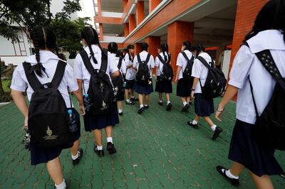 Girls walk to their classrooms before the start of their lesson day in Bangkok, Thailand September 15, 2020. Picture taken September 15, 2020. REUTERS/Jorge Silva