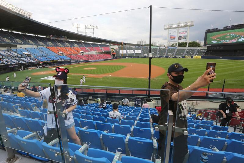 Fans take a selfie before the KBO league game between Doosan Bears and LG Twins in Seoul. AP