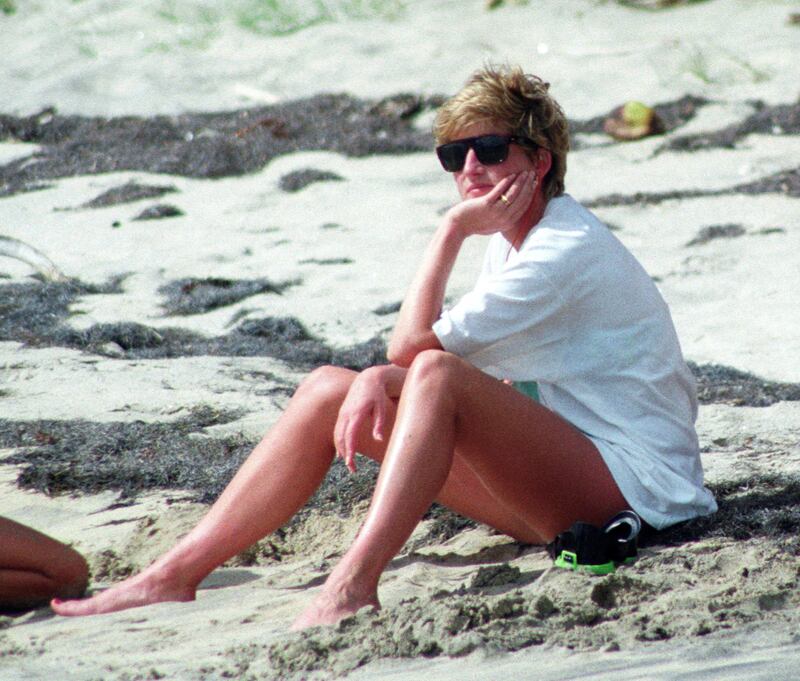 FILE PHOTO: Princess Diana relaxes on the sand during a visit to the beach on the Caribbean Island of Nevis January 4, 1993. REUTERS/Mark Cardwell/File Photo