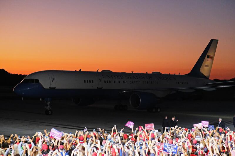 Crowds cheer as Air Force One taxis outside a rally for Donald Trump in Pensacola, Florida. EPA