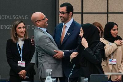 UN Climate Change Executive Secretary Simon Stiell, left, greets Dr Sultan Al Jaber at the UN Climate Change Conference in Bonn, Germany. AP
