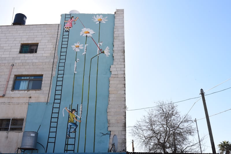 A mural on the side of a building in Beitin, West Bank. 