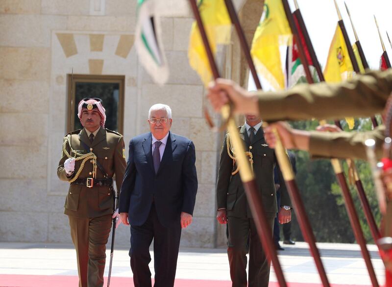 Palestinian president Mahmoud Abbas inspects an honour guard as he arrives to meet with Jordan's King Abdullah II at the Royal Palace in Amman, Jordan. Reuters