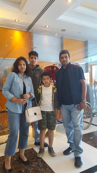 Aditya Dewasthalee, a student at Lancaster University, with his parents and brother. He hopes to be able to fly back to the Emirates to see them at the end of term. Courtesy: Aditya Dewasthalee