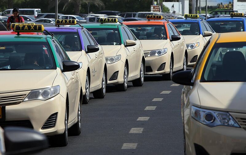 Dubai,United Arab Emirates- July, 28, 2015:  Dubai Taxis outside the Deira City Centre in Dubai . ( Satish Kumar / The National ) For News *** Local Caption ***  SK-DubaiTaxi-28072015-08.jpg