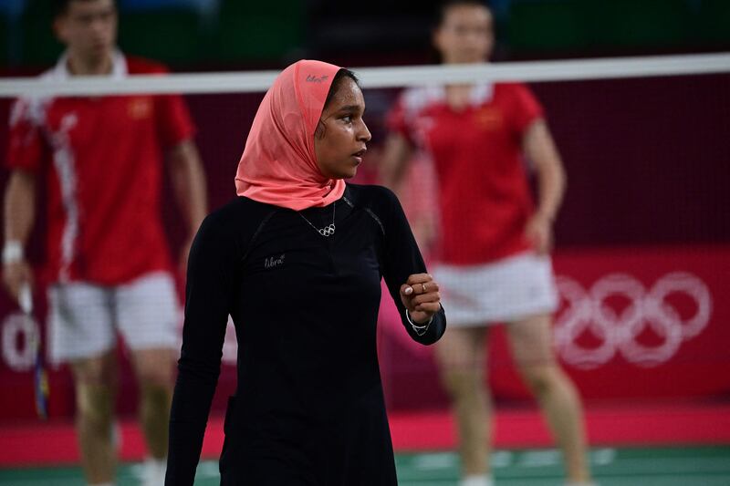 Egypt's Doha Hany competes in a mixed doubles badminton match with her unseen partner,  Adham Hatem Elgamal, against China's Zheng Siwei and Huang Yaqiong.