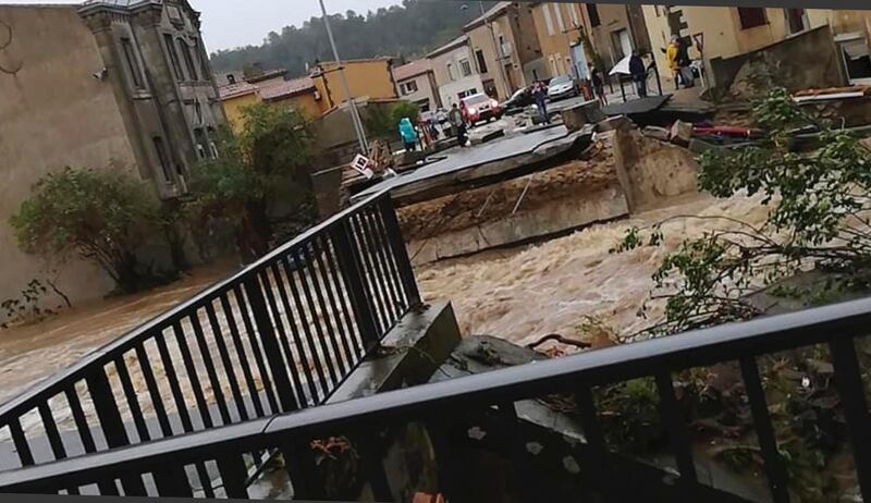 A torrent of water ripped out the bridge in Villegailhenc. AP Photo