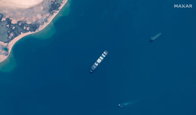 This image provided by Maxar Technologies shows the Ever Given cargo vessel that Egyptian authorities impounded after the massive ship blocked the Suez Canal last month, anchored in the northeastern section of Egyptâ€™s Great Bitter Lake, Monday, April 12, 2021. The Suez Canal chief said Monday the authority will not allow the hulking Ever Given to leave the country until a compensation amount is settled on with its Japanese owner, Shoei Kisen Kaisha Ltd. The Panama-flagged ship carries some $3.5 billion worth of cargo between Asia and Europe. (Satellite image Â©2021 Maxar Technologies via AP)