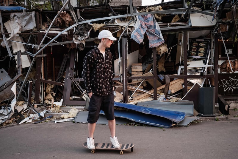 Lone skater Roman Kovalenko, 18, amid the damage at Peace Square in Kramatorsk, eastern Ukraine. All of his friends have fled. AFP