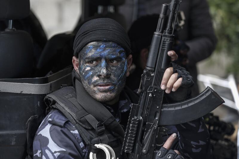 A Palestinian Hamas police cadet takes part in a graduation ceremony at the Arafat City police headquarters in Gaza city. AFP