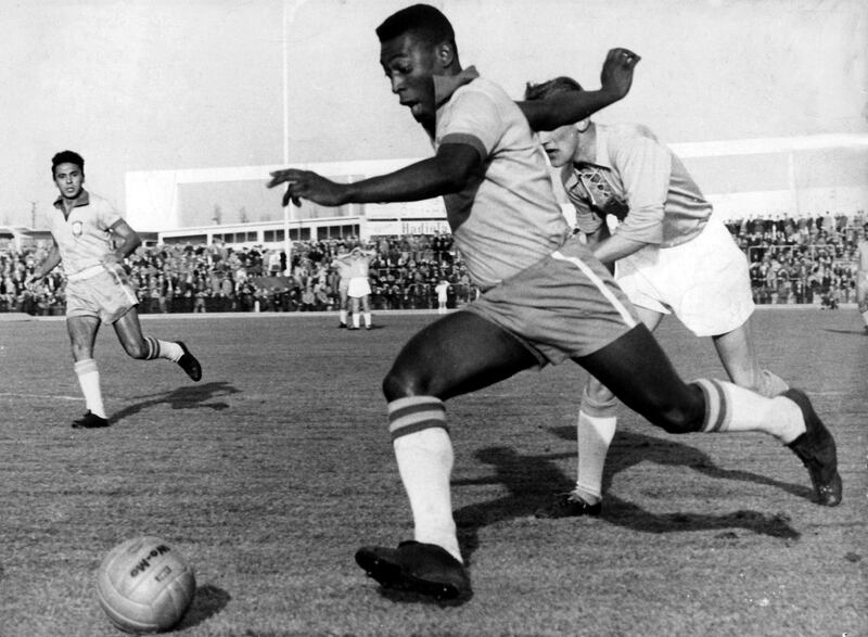 Brazilian striker Pele (front) runs with the ball past a Swedish defender of the Malmoe FF soccer club during an international friendly between Malmoe FF and the Brazilian national team in Malmoe, Sweden, 8 May 1960. Brazil won 7-1. Pele became famous when he played with the Brazilian national team at the 1958 FIFA World Cup in Sweden and won the first World Champion title for Brazil.