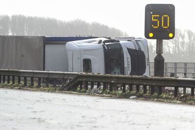 A Storm Eunice-toppled toppled lorry on the M4 motorway near Margam in south Wales. AFP