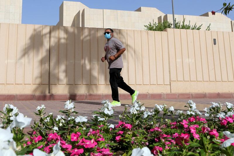 A man wears a protective face mask while jogging in Riyadh, Saudi Arabia. Reuters