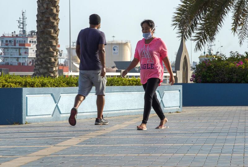 Abu Dhabi, United Arab Emirates, June 14, 2020.     Abu Dhabi residents exercise on the reopened side of the Corniche as the UAE gradually returns to normal life as restrictions are being eased. Victor Besa  / The NationalSection:  NAReporter: