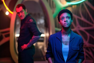 This image released by Netflix shows DemiÃ¡n Bichir, left, and Tiffany Boone in a scene from "The Midnight Sky." (Philippe Antonello/Netflix via AP)