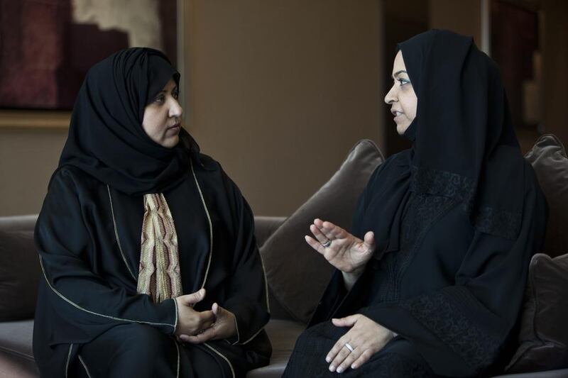 Salwa Al Rahma, left, who survived two bouts of cancer, with her sister Sawsan who recovered from Hodgkin lymphoma, at a Friends of Cancer Patients Society meeting in Dubai. Antonie Robertson/The National