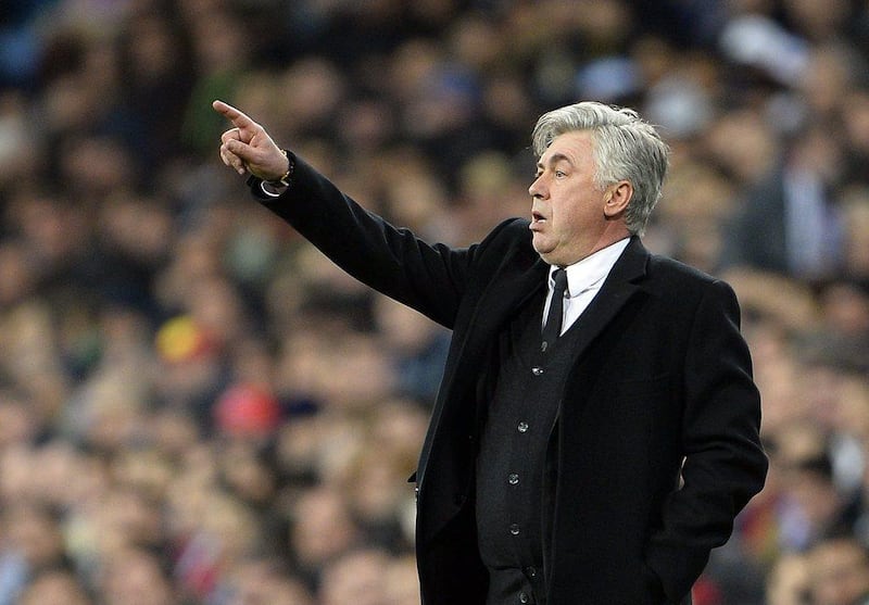 Real Madrid coach Carlo Ancelotti gestures during the Spanish Copa del Rey semifinal first-leg football match against Club Atletico de Madrid at the Santiago Bernabeu stadium in Madrid on Wednesday. AFP PHOTO/ GERARD JULIEN