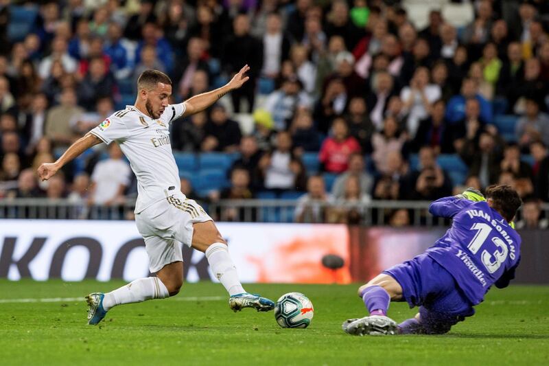 Real Madrid's Eden Hazard attempts to round Leganes' goalkeeper Juan Soriano. EPA