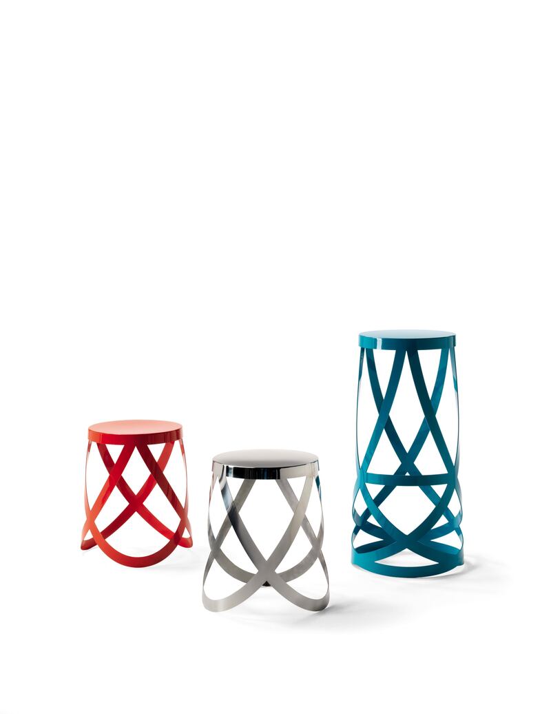 Series of high and low stools, realised in metal laser-cut plate, folded up and polish lacquered in white, black, red, yellow and blue colours. A small magnetic cushion for the seat in polyurethane foam upholstered in fabric (Polaris or Hallingdal) in mat???