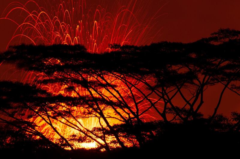 A lava fissure erupts in the air during a volcano outbreak at Pahoa, Hawaii. John Linzmeier / EPA