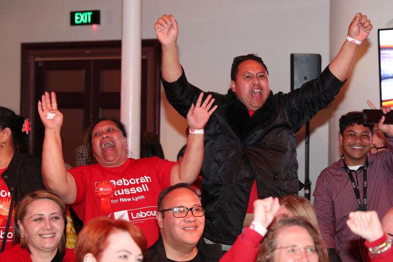 Labour party supporters react as Leader Jacinda Ardern arrives to claim victory. AFP