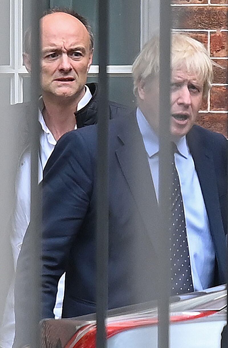 (FILES) In this file photo taken on September 03, 2019 Britain's Prime Minister Boris Johnson (R) and his special advisor Dominic Cummings leave from the rear of Downing Street in central London, before heading to the Houses of Parliament. British Prime Minister Boris Johnson faced growing scrutiny on April 25, 2021, following explosive accusations by his former chief aide Dominic Cummings earlier this week that he lacks competence and integrity. / AFP / DANIEL LEAL-OLIVAS
