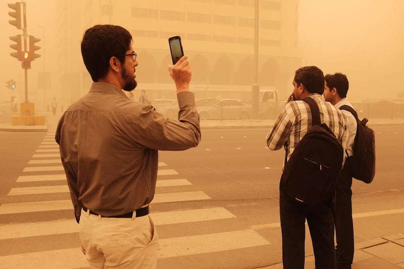 Abu Dhabi, UAE- April 02 2015: Residents woke up to find the capital blanketed by a sandstorm that reduced visibility on the roads and forced people to wear dust masks and cover their faces. Deepthi Unnikrishnan/The National *** Local Caption ***  DU - 02022015 - Sandstorm 04.JPG