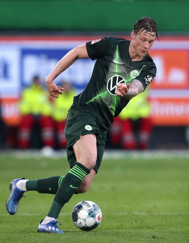 Wolfsburg's Dutch forward Wout Weghorst runs with the ball during the German first division Bundesliga football match between VfL Wolfsburg and RB Leipzig in Wolfsburg, northern Germany, on March 7, 2020. (Photo by Ronny Hartmann / AFP) / DFL REGULATIONS PROHIBIT ANY USE OF PHOTOGRAPHS AS IMAGE SEQUENCES AND/OR QUASI-VIDEO