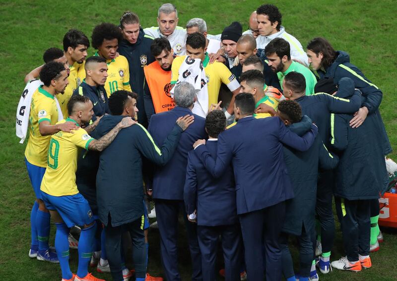 Brazil's team huddles before the penalty shoot-out. AP Photo