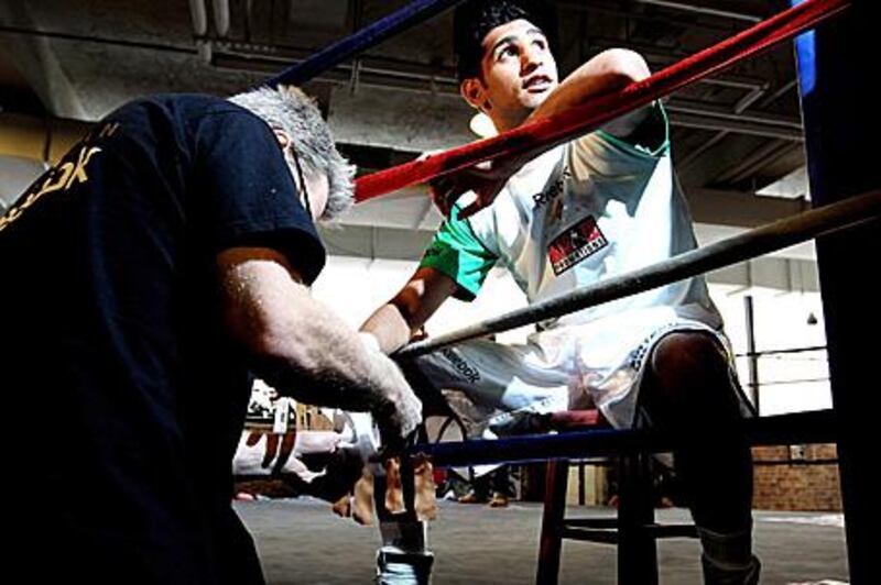 Amir Khan is making his American debut against Paulie Malignaggi at Madison Square Garden in New York.