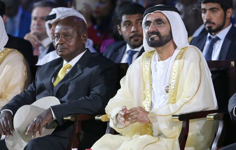 CORRECTION - Vice President of the United Arab Rulerates (UAE) and Ruler of Dubai Sheikh Mohammed bin Rashid Al Maktoum (R) sits next to Uganda's President Yoweri Museveni during the opening of the Global Business Forum on Africa, in Dubai on November 1, 2017. 
 / AFP PHOTO / “The erroneous mention[s] appearing in the metadata of this photo by KARIM SAHIB has been modified in AFP systems in the following manner: "Ruler of Dubai " instead of "Emir of Dubai" . Please immediately remove the erroneous mention from all your online services and delete it (them) from your servers. If you have been authorized by AFP to distribute it to third parties, please ensure that the same actions are carried out by them. Failure to promptly comply with these instructions will entail liability on your part for any continued or post notification usage. Therefore we thank you very much for all your attention and prompt action. We are sorry for the inconvenience this notification may cause and remain at your disposal for any further information you may require.”