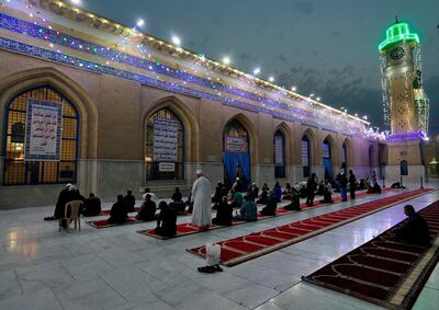 FILE - In this Saturday, April 10, 2021, file photo, Muslims perform evening prayer at the Sunni shrine of Abdul-Qadir al-Gailani, ahead of the upcoming Muslim fasting month of Ramadan, in Baghdad, Iraq. Muslims are facing their second Ramadan in the shadow of the pandemic. Many Muslim majority countries have been hit by an intense new coronavirus wave. While some countries imposed new Ramadan restrictions, concern is high that the monthâ€™s rituals could stoke a further surge. (AP Photo/Khalid Mohammed, File)