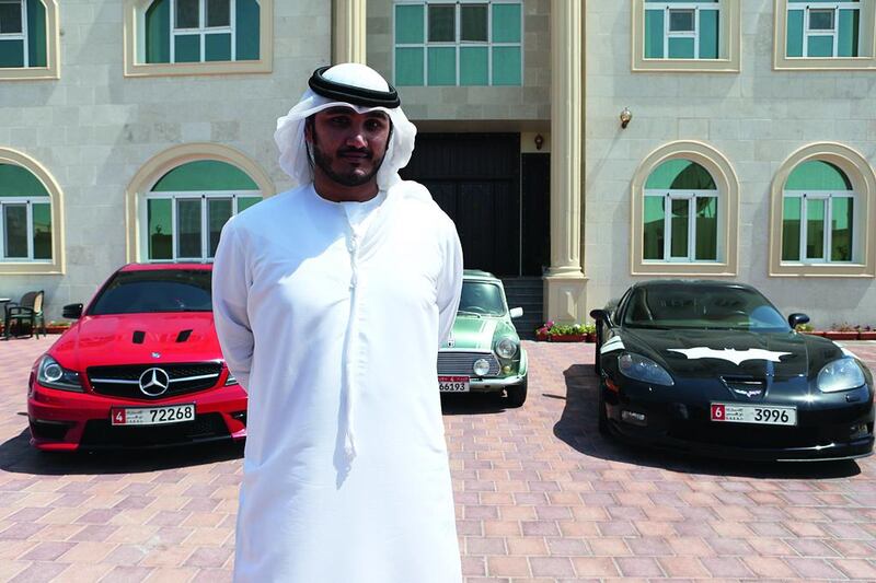 Hamad Alkhoori with, from left, his Mercedes, Mini Cooper and ‘Batmobile’ Corvette. Fatima Al Marzooqi/ The National