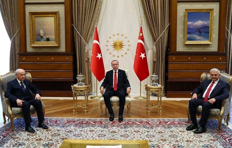 Turkish President Tayyip Erdogan meets with Nationalist Movement Party (MHP) leader Devlet Bahceli as they are flanked by Prime Minister Binali Yildirim in Ankara, Turkey, June 27, 2018. Kayhan Ozer/Presidential Palace/Handout via REUTERS ATTENTION EDITORS - THIS IMAGE HAS BEEN SUPPLIED BY A THIRD PARTY. NO RESALES. NO ARCHIVES