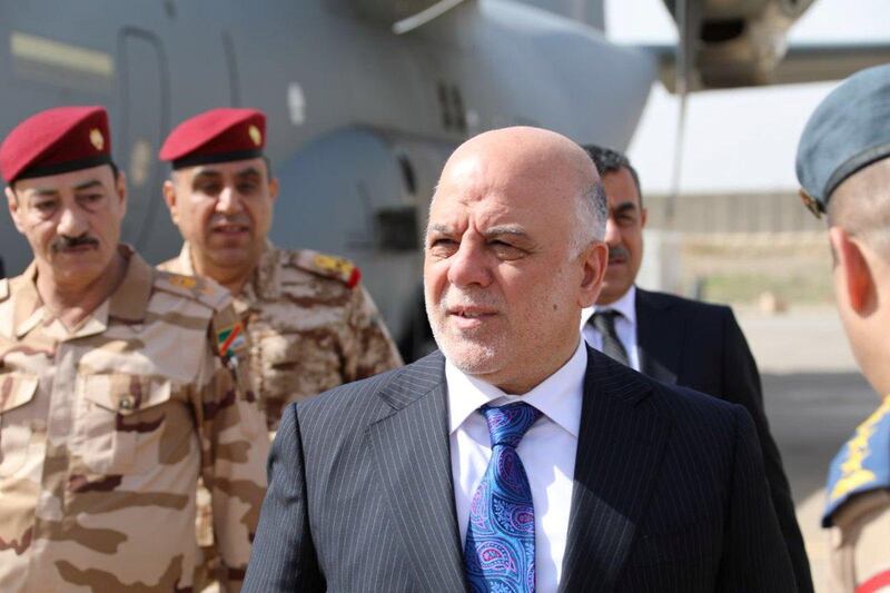 Iraqi Prime Minister Haider al-Abadi walks with officers as he arrives in Mosul, Iraq, March 14, 2018. Iraqi Prime Minister Media Office/Handout via REUTERS ATTENTION EDITORS - THIS IMAGE WAS PROVIDED BY A THIRD PARTY. NO RESALES. NO ARCHIVES.