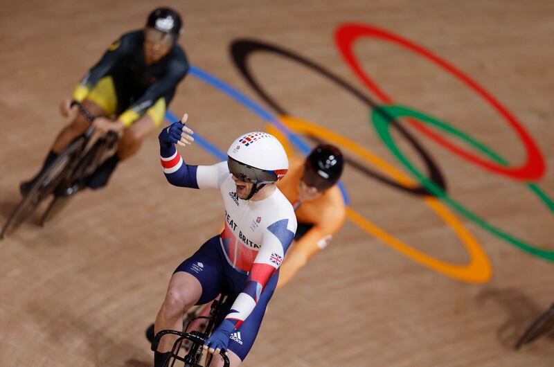 Britain's Jason Kenny celebrates after winning the men's track cycling keirin final.