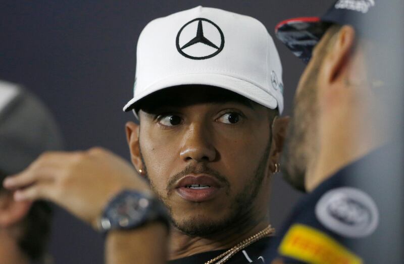 Mercedes driver Lewis Hamilton of Britain listens to Red Bull Racing driver Daniel Ricciardo of Australia during a press conference for the British Formula One Grand Prix at Silverstone circuit, Silverstone, England, Thursday, July 13, 2017. The British Grand Prix will be held on Sunday, July 16,2017. (AP Photo/Frank Augstein)