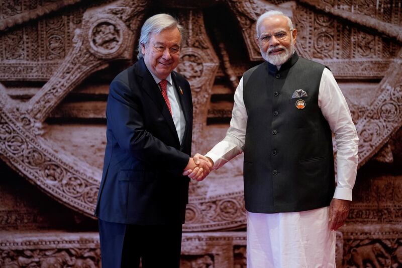 Indian Prime Minister Narendra Modi greets UN  Secretary General Antonio Guterres. Reuters
