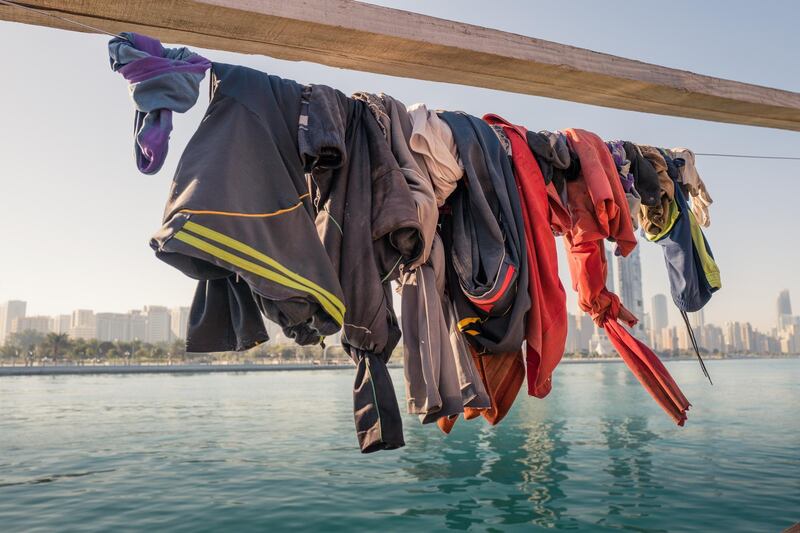 A worker’s clothes-line at Mina Zayed. Fishermen take their best shirts to the laundrette to be pressed when they visit malls and the downtown on their day off. Courtesy Sohail Karmani