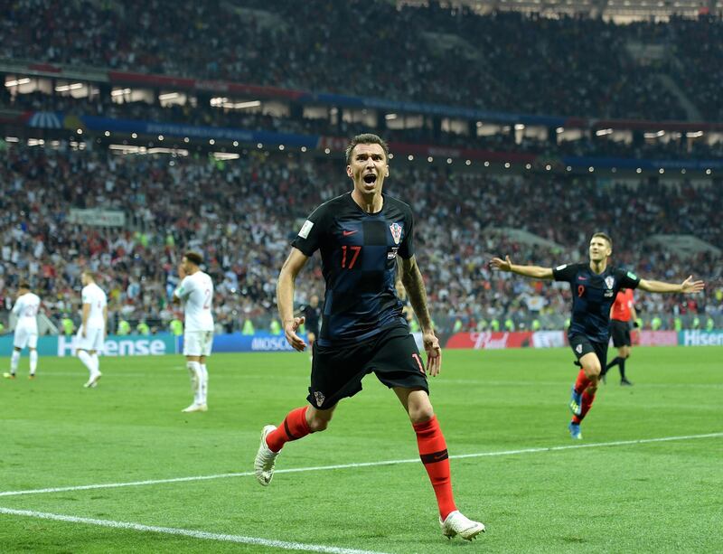 epa06881983 Mario Mandzukic of Croatia celebrates scoring the 2-1 lead during the FIFA World Cup 2018 semi final soccer match between Croatia and England in Moscow, Russia, 11 July 2018.

(RESTRICTIONS APPLY: Editorial Use Only, not used in association with any commercial entity - Images must not be used in any form of alert service or push service of any kind including via mobile alert services, downloads to mobile devices or MMS messaging - Images must appear as still images and must not emulate match action video footage - No alteration is made to, and no text or image is superimposed over, any published image which: (a) intentionally obscures or removes a sponsor identification image; or (b) adds or overlays the commercial identification of any third party which is not officially associated with the FIFA World Cup)  EPA/PETER POWELL   EDITORIAL USE ONLY