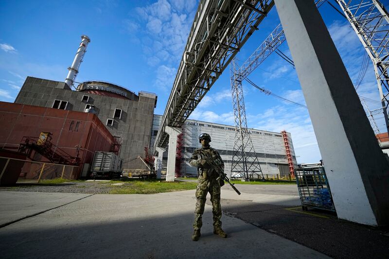 A Russian soldier guards an area of the Zaporizhzhia nuclear plant in Enerhodar, Ukraine. AP