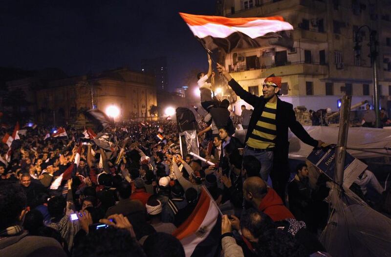 Egyptians celebrate in Tahrir Square after hearing the news of the resignation of president Hosni Mubarak on February 11, 2011. John Moore / Getty Images 