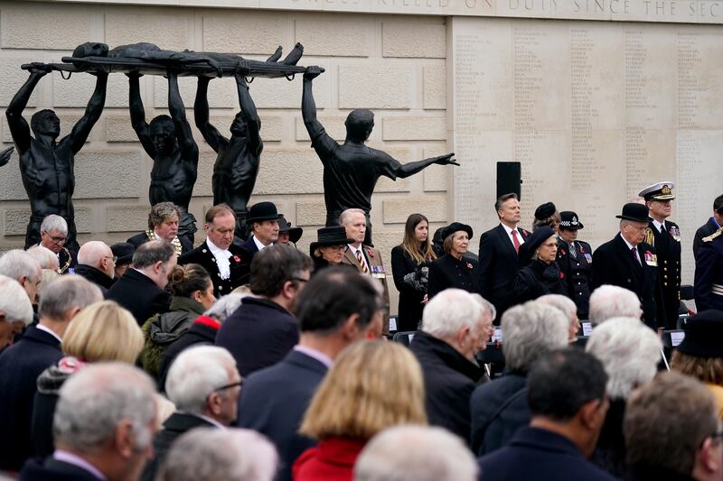 People gather at the Armed Forces Memorial at the National Memorial Arboretum in Alrewas, Staffordshire. PA