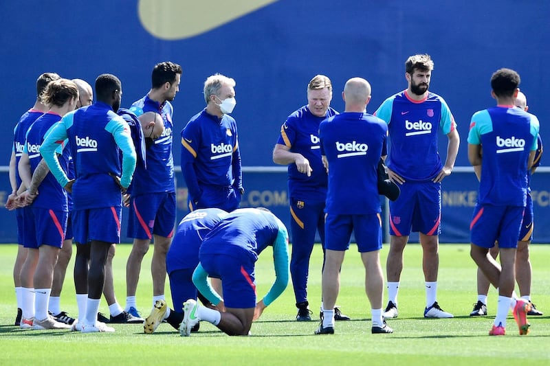 Barcelona manager Ronald Koeman talks to his players during a training session at the Joan Gamper Sports City ahead of the final La Liga game of the season. AFP