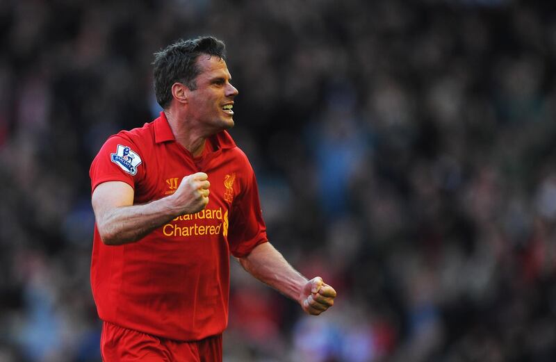 LIVERPOOL, ENGLAND - APRIL 21:  Jamie Carragher of Liverpool celebrates the equalising goal scored by Luis Suarez during the Barclays Premier League match between Liverpool and Chelsea at Anfield on April 21, 2013 in Liverpool, England.  (Photo by Michael Regan/Getty Images)