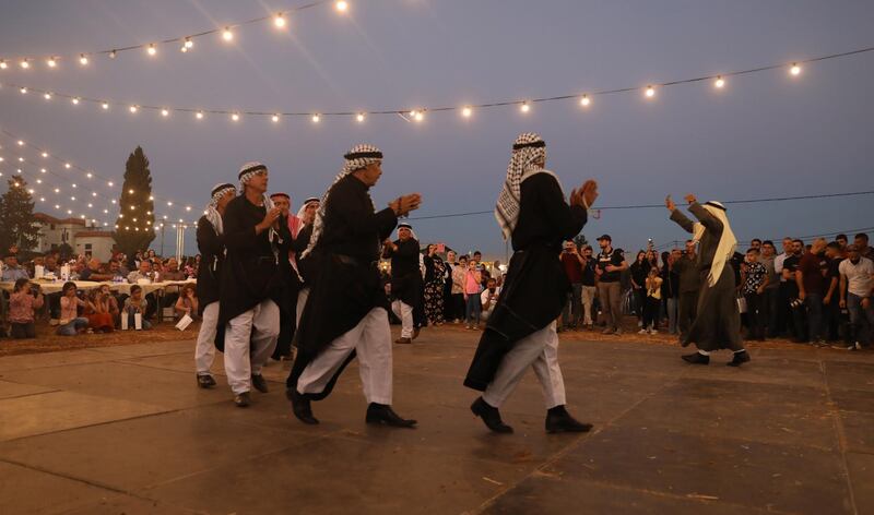 Palestinian farmers dancing at the first annual wheat festival at Jalamah village near the West Bank city of Jenin. EPA